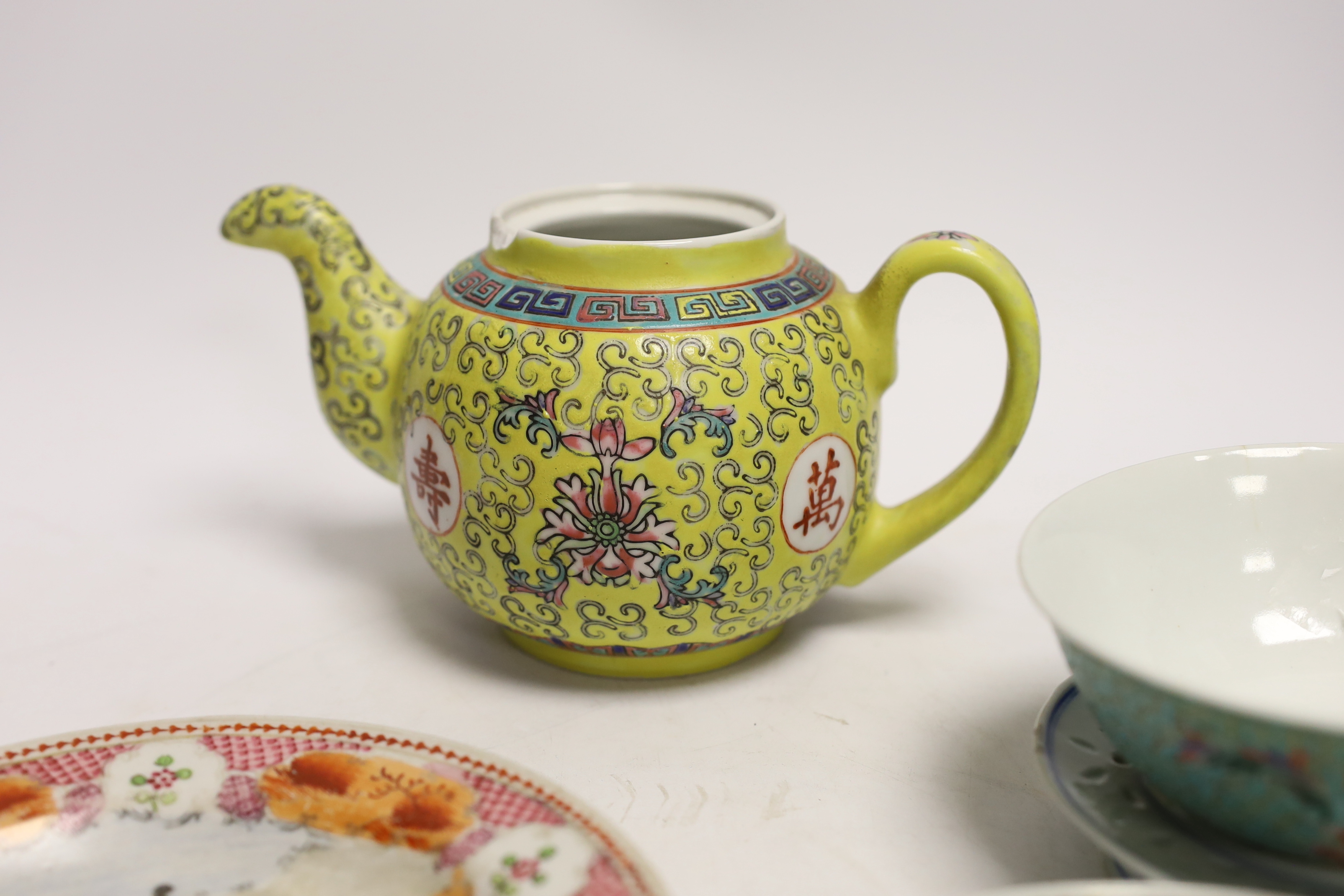 Six Chinese ceramic items; a teapot, two bowls and three small dishes, teapot 10cm